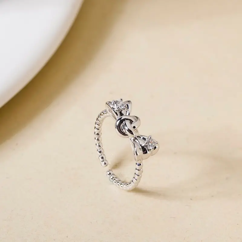 Bowtie-Shaped Silver Ring With Stone Center 1