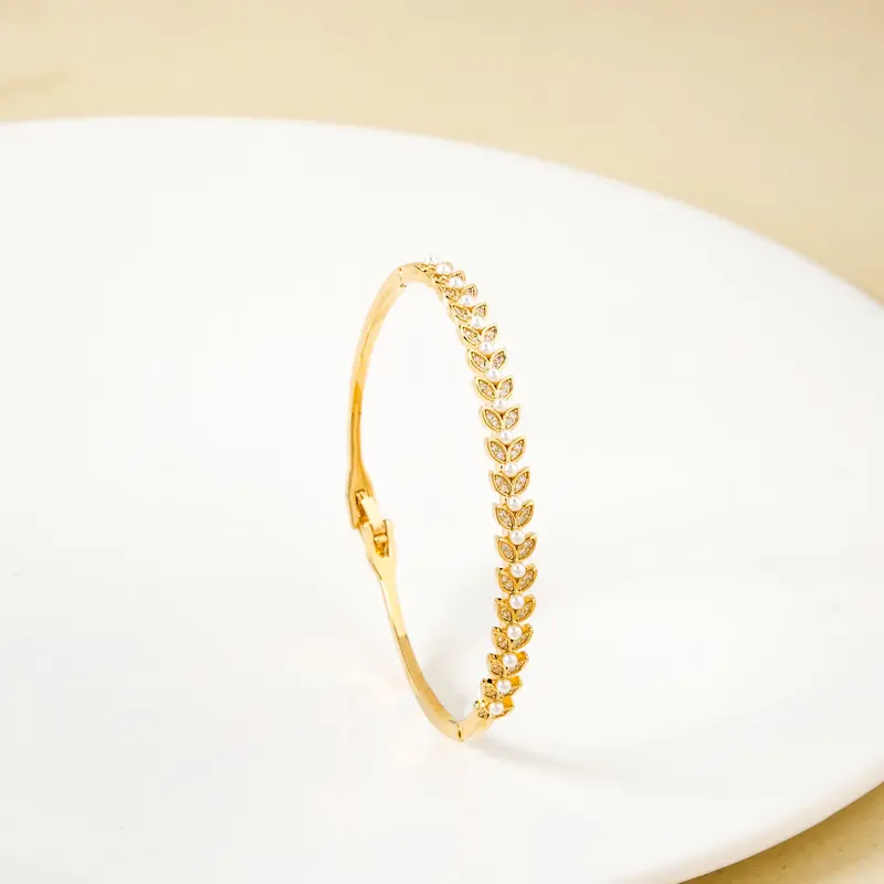 Pearl-Adorned Ivy-Inspired Gold Bracelet 1